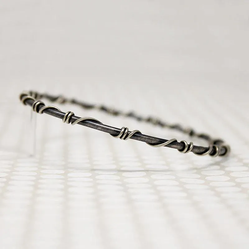 The Infinity Twist Silver Bangle from Allie B.