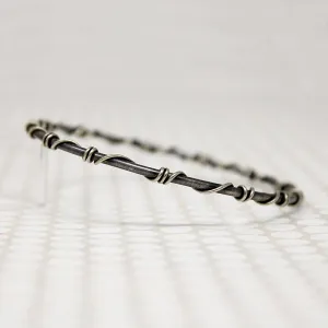 The Infinity Twist Silver Bangle from Allie B.