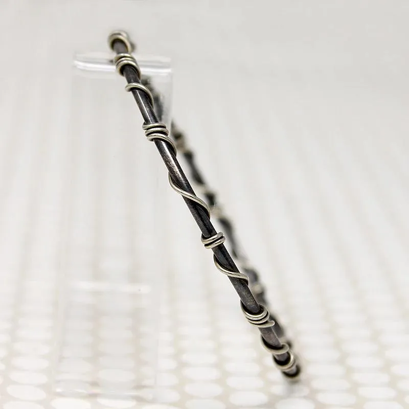 The Infinity Twist Silver Bangle from Allie B.