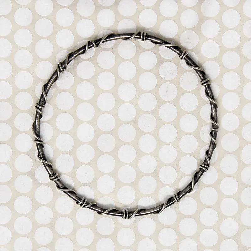 The Infinity Twist Silver Bangle from Allie B.